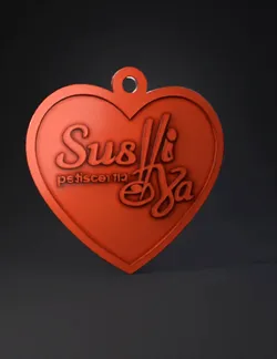 red heart shaped pendant with raised script and loop for chain