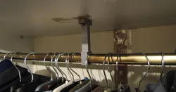 Wardrobe hanging rail support