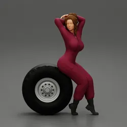 2 Models - SEXY GIRL MECHANIC IN SUIT SITTING ON A TRUCK TYRE AND HANDS IN HAIR