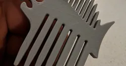 Fish-shaped beard comb