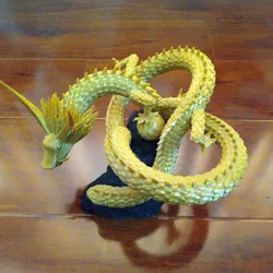 Torus knot dragon and pearl