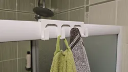 Hanging towel rack for the shower wall