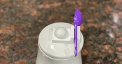 Spoon holder for ceramic canister