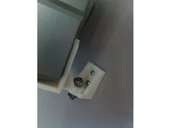 Wall mount for a Sony home theater speaker.
