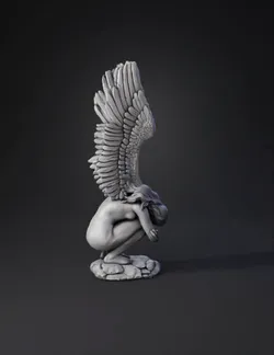 winged angel statue with large feathered wings kneeling on a rock gr